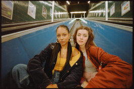 subway-two-girlfriends-posing-sitting-on-escalator-stairs-real-analog-kodak-gold 