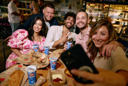 fun-group-selfie-around-dinner-table-happy-faces-big-smiles-analog-flash-photography 