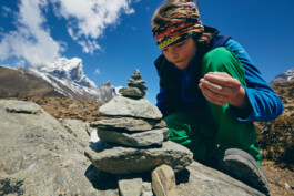 nepal-boy-building-stone-tower-khumbu-valley-nepal-trekking 